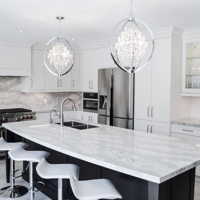 Inspiration for a large transitional l-shaped porcelain tile and gray floor enclosed kitchen remodel in Toronto with shaker cabinets, white cabinets, quartz countertops, stainless steel appliances, an island, a double-bowl sink and gray backsplash