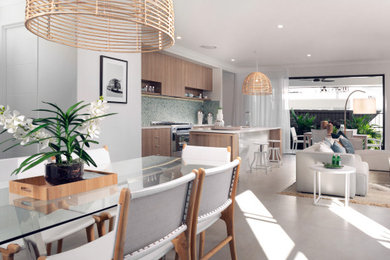 Inspiration for a large scandi open plan kitchen in Brisbane with a double-bowl sink, light wood cabinets, green splashback, ceramic splashback, stainless steel appliances, ceramic flooring, an island, white floors and white worktops.