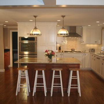 Beach white kitchen with cherry amber island