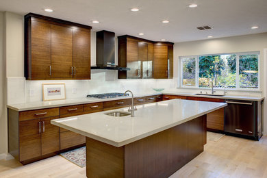 Example of a mid-sized asian light wood floor kitchen design in Sacramento with an undermount sink, flat-panel cabinets, medium tone wood cabinets, quartz countertops, beige backsplash, ceramic backsplash, colored appliances and an island