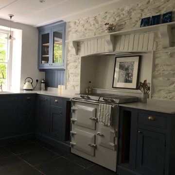 Beautiful blue hand painted country cottage kitchen with glazed cabinet
