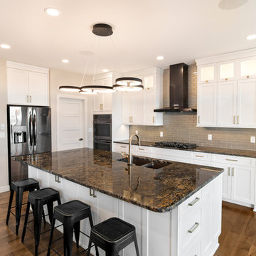 Beautiful Contemporary Kitchen w/ Dark Granite Countertops and Modern Lighting