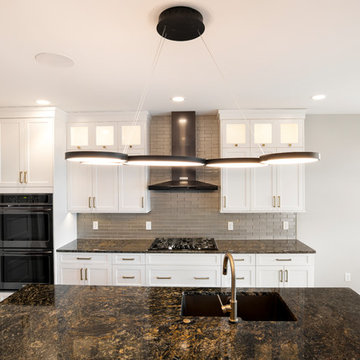 Beautiful Contemporary Kitchen w/ Dark Granite Countertops and Modern Lighting