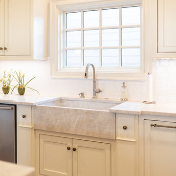 Beautiful custom quartzite apron front sink to match counters.