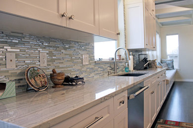Example of a trendy galley kitchen design in Denver with an island