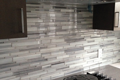Inspiration for a modern kitchen remodel in Vancouver with gray backsplash and glass tile backsplash