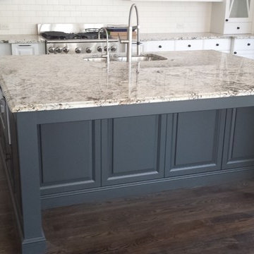 Beautiful White Granite On Large Island with Darker Cabinets