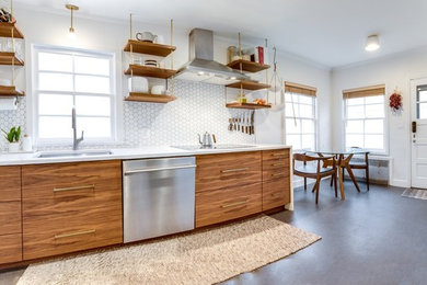 Mid-sized minimalist single-wall concrete floor and gray floor eat-in kitchen photo in Portland with an undermount sink, flat-panel cabinets, dark wood cabinets, granite countertops, white backsplash, ceramic backsplash, white appliances, no island and white countertops