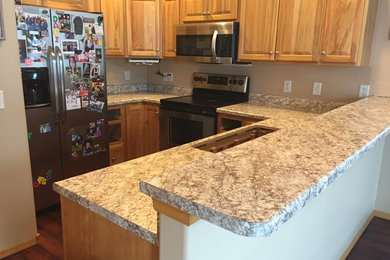 Example of a classic kitchen design in Other with laminate countertops