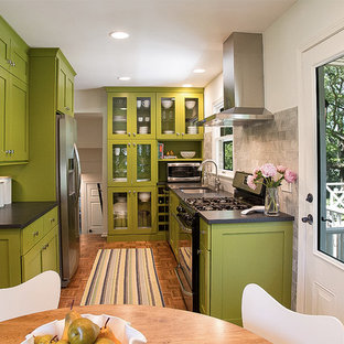Design ideas for a small midcentury galley eat-in kitchen in Other with an undermount sink, shaker cabinets, green cabinets, laminate benchtops, grey splashback, stone tile splashback, stainless steel appliances and medium hardwood floors.
