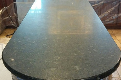 Inspiration for an eat-in kitchen remodel in Philadelphia with granite countertops and an island