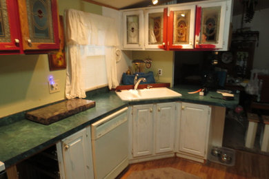 Example of a mid-sized l-shaped eat-in kitchen design in Boise with no island, red cabinets, concrete countertops, black backsplash, cement tile backsplash and white appliances