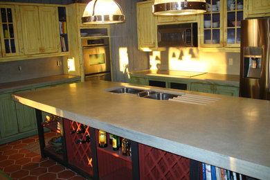 Large arts and crafts l-shaped terra-cotta tile eat-in kitchen photo in Toronto with an undermount sink, glass-front cabinets, distressed cabinets, concrete countertops, gray backsplash, cement tile backsplash, stainless steel appliances and an island