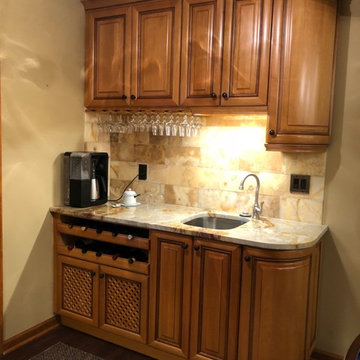 Beige Countertops with Rich Medium Wood Cabinets