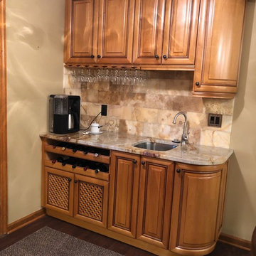 Beige Countertops with Rich Medium Wood Cabinets