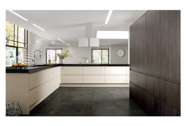 This is an example of a contemporary grey and cream kitchen in Other.
