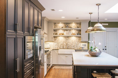Kitchen - large contemporary light wood floor kitchen idea in Nashville with a farmhouse sink, recessed-panel cabinets, gray cabinets, quartzite countertops, multicolored backsplash, ceramic backsplash, stainless steel appliances and an island