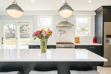Example of a mid-sized transitional single-wall eat-in kitchen design in New York
