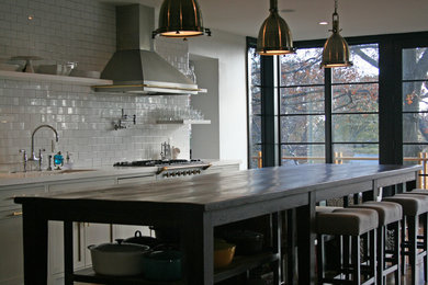 Inspiration for a kitchen remodel in Nashville with recessed-panel cabinets, white backsplash and subway tile backsplash