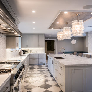 Inspiration for a large midcentury u-shaped eat-in kitchen in Los Angeles with an undermount sink, shaker cabinets, grey cabinets, quartz benchtops, white splashback, marble splashback, black appliances, marble floors, with island and white floor.