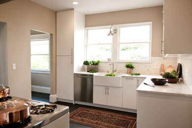 Inspiration for a mid-sized modern l-shaped enclosed kitchen remodel in San Francisco with a farmhouse sink, flat-panel cabinets, white cabinets, marble countertops, white backsplash, stone tile backsplash and stainless steel appliances