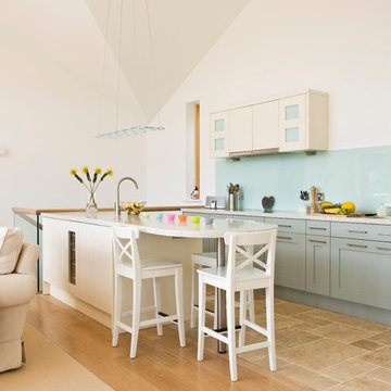 Bespoke Coastal Slab And Shaker Kitchen With Recycled Glass/Oyster Shell Detail