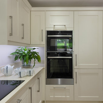 Bespoke cream shaker large open kitchen with built in Oven and hob. Chrome handl