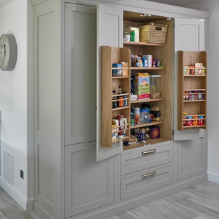 Design ideas for a medium sized traditional single-wall kitchen/diner in Other with shaker cabinets, grey cabinets, grey floors, a submerged sink, quartz worktops, white splashback, stainless steel appliances, porcelain flooring, an island and white worktops.
