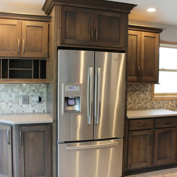 Bettendorf, IA- Gorgeous Galley Kitchen Remodel With Gray Stain and Quartz Tops