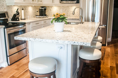 Example of a transitional kitchen design in Toronto