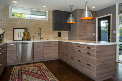 This is an example of a medium sized contemporary u-shaped open plan kitchen in Los Angeles with a submerged sink, flat-panel cabinets, grey cabinets, engineered stone countertops, wood splashback, stainless steel appliances, concrete flooring, a breakfast bar, brown splashback and brown floors.