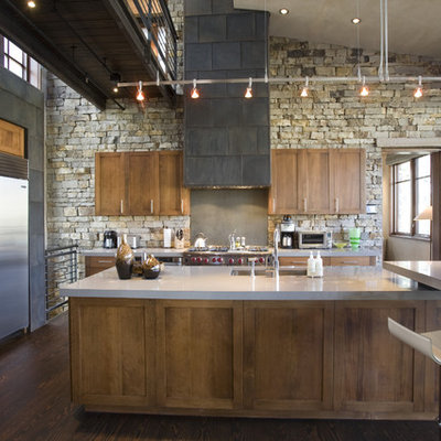 Urban kitchen photo in Denver with stainless steel appliances, shaker cabinets, dark wood cabinets and an undermount sink