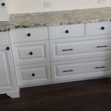 Bianco Antico Granite Tops on White Cabinets