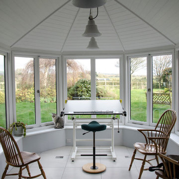 Black and white kitchen leading to conservatory