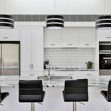 Black and white pendant lights above the main island