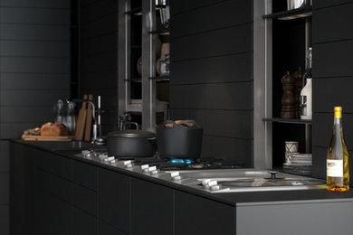 Imagen de cocina contemporánea de tamaño medio con fregadero encastrado, encimera de acrílico, salpicadero negro, electrodomésticos de acero inoxidable, suelo de cemento y una isla