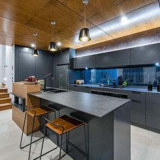 Inspiration for a contemporary galley kitchen in Canberra - Queanbeyan with a drop-in sink, flat-panel cabinets, grey cabinets, window splashback, black appliances, with island, grey floor and grey benchtop.