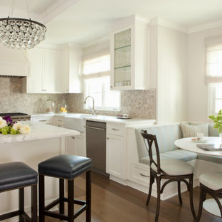 Large transitional eat-in kitchen inspiration - Eat-in kitchen - large transitional l-shaped dark wood floor and brown floor eat-in kitchen idea in Los Angeles with a farmhouse sink, shaker cabinets, white cabinets, gray backsplash, stainless steel appliances, an island, marble countertops and stone tile backsplash