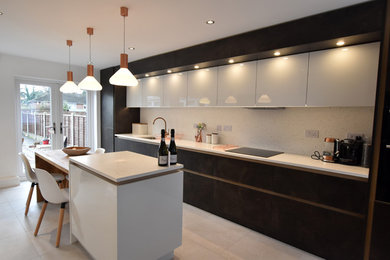 Inspiration for a large contemporary galley kitchen/diner in West Midlands with flat-panel cabinets, brown cabinets, engineered stone countertops, porcelain flooring, an island and beige floors.