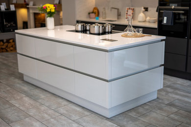 Inspiration for a medium sized kitchen in Other with quartz worktops, white splashback, an island and white worktops.