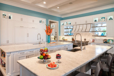 Trendy galley kitchen photo in Miami with marble countertops, white backsplash, stone tile backsplash and two islands