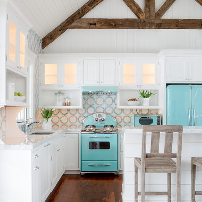 Small beach style l-shaped medium tone wood floor open concept kitchen photo in St Louis with white cabinets, multicolored backsplash, colored appliances, an island, an undermount sink, beaded inset cabinets, quartz countertops and mosaic tile backsplash