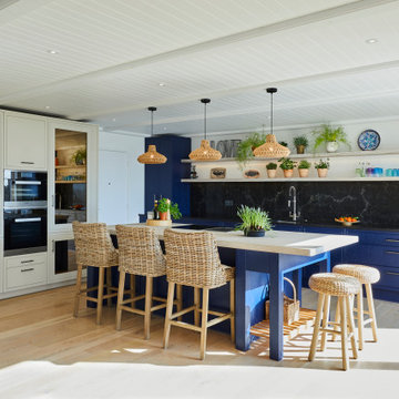 Blue coastal-inspired kitchen with rattan and wicker décor