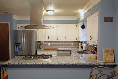 Photo of a small classic u-shaped kitchen/diner in Austin with a submerged sink, recessed-panel cabinets, white cabinets, granite worktops, grey splashback, metro tiled splashback, stainless steel appliances, a breakfast bar and grey worktops.