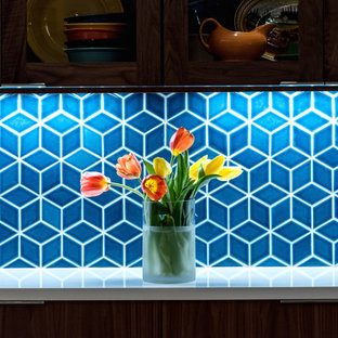 Inspiration for a mid-sized midcentury l-shaped eat-in kitchen in Austin with medium wood cabinets, blue splashback, ceramic splashback, stainless steel appliances, with island, beige floor and grey benchtop.