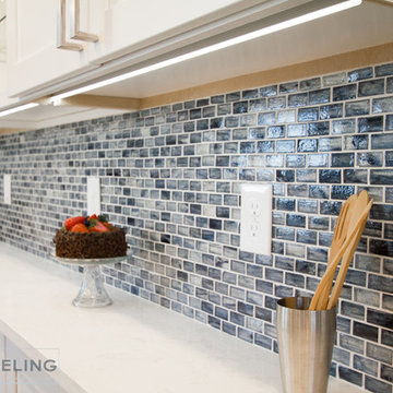 Blue Mosaic Tile Backsplash with White LED Cabinet Underlighting