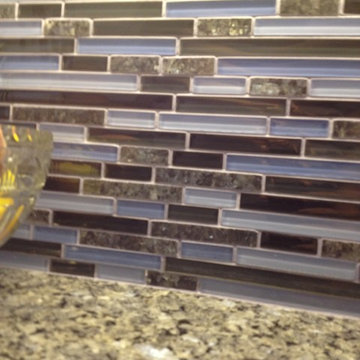 Blue Pearl granite counter & glass mosaic tile with blue grout