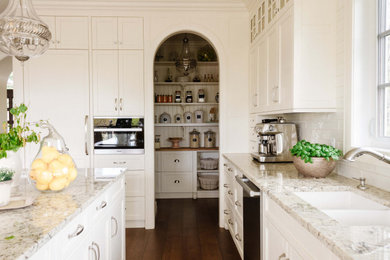 Example of a french country kitchen design in Calgary