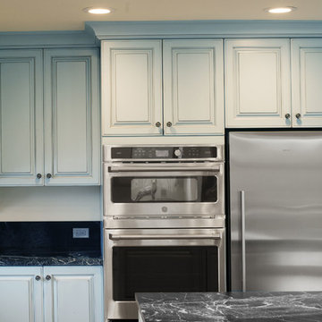 Blue Traditional Cabinets and Stainless Steel Appliances