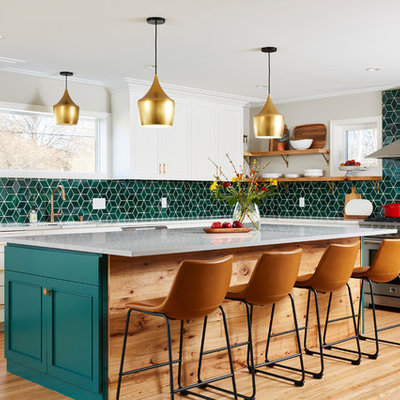 Large transitional l-shaped light wood floor and beige floor kitchen photo in Minneapolis with white cabinets, ceramic backsplash, an island, recessed-panel cabinets, green backsplash, stainless steel appliances and gray countertops